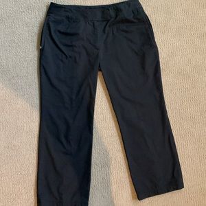 Black Nike golf capri pants with zip ankle.  Size 6.